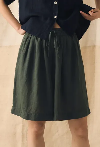 Model wearing a green cotton skirt